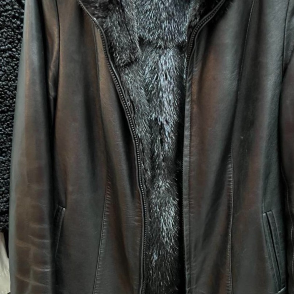 Leather coat with reversible fur inside